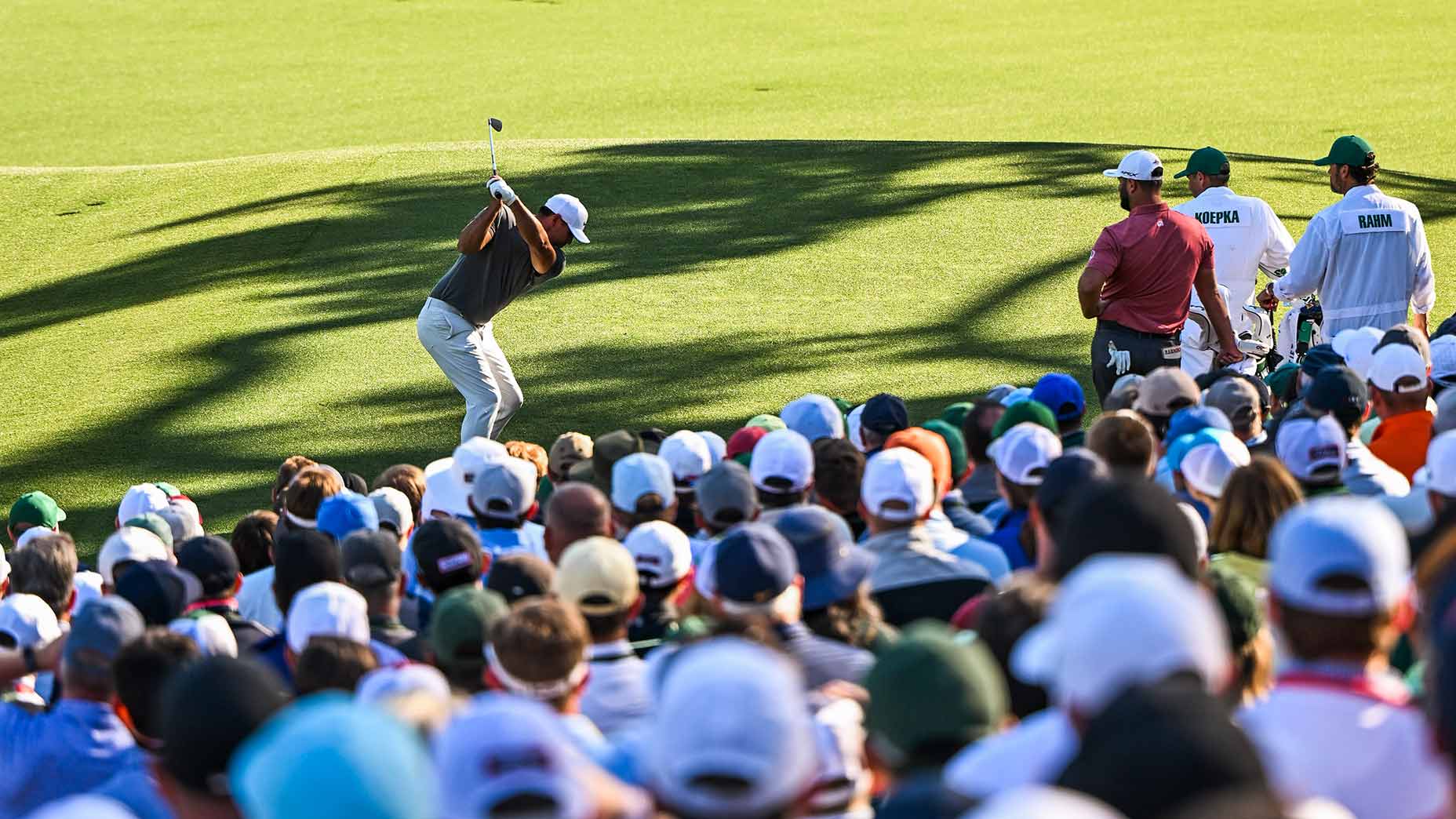 brooks koepka tees off on the 12th hole at augusta national