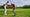 golf teacher gives pointers to student