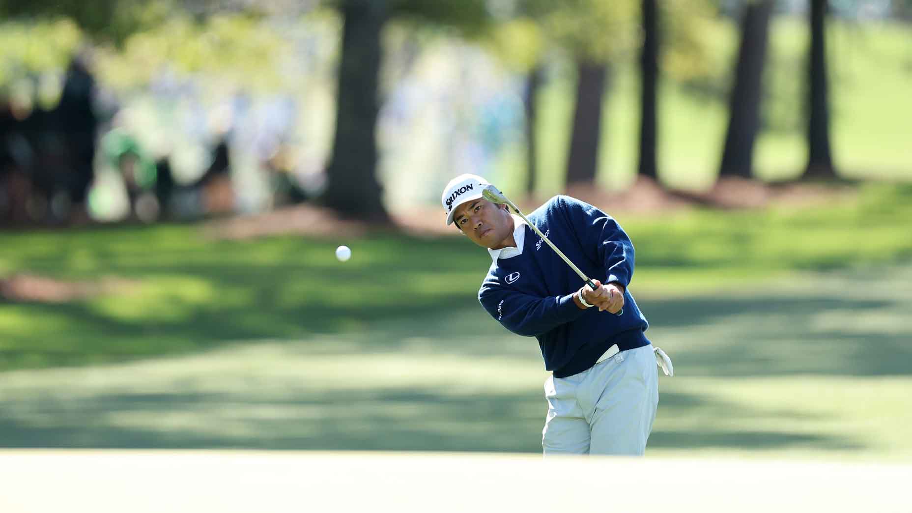 hideki matsuyama hits a chip shot in a practice round for the 2025 masters