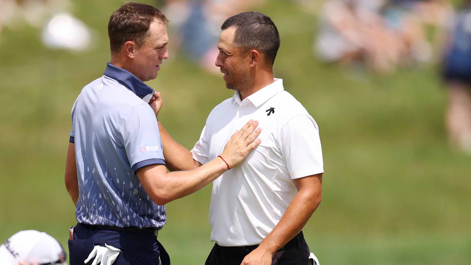 Justin Thomas talks with Xander Schauffele after the first round of the 2024 PGA Championship.