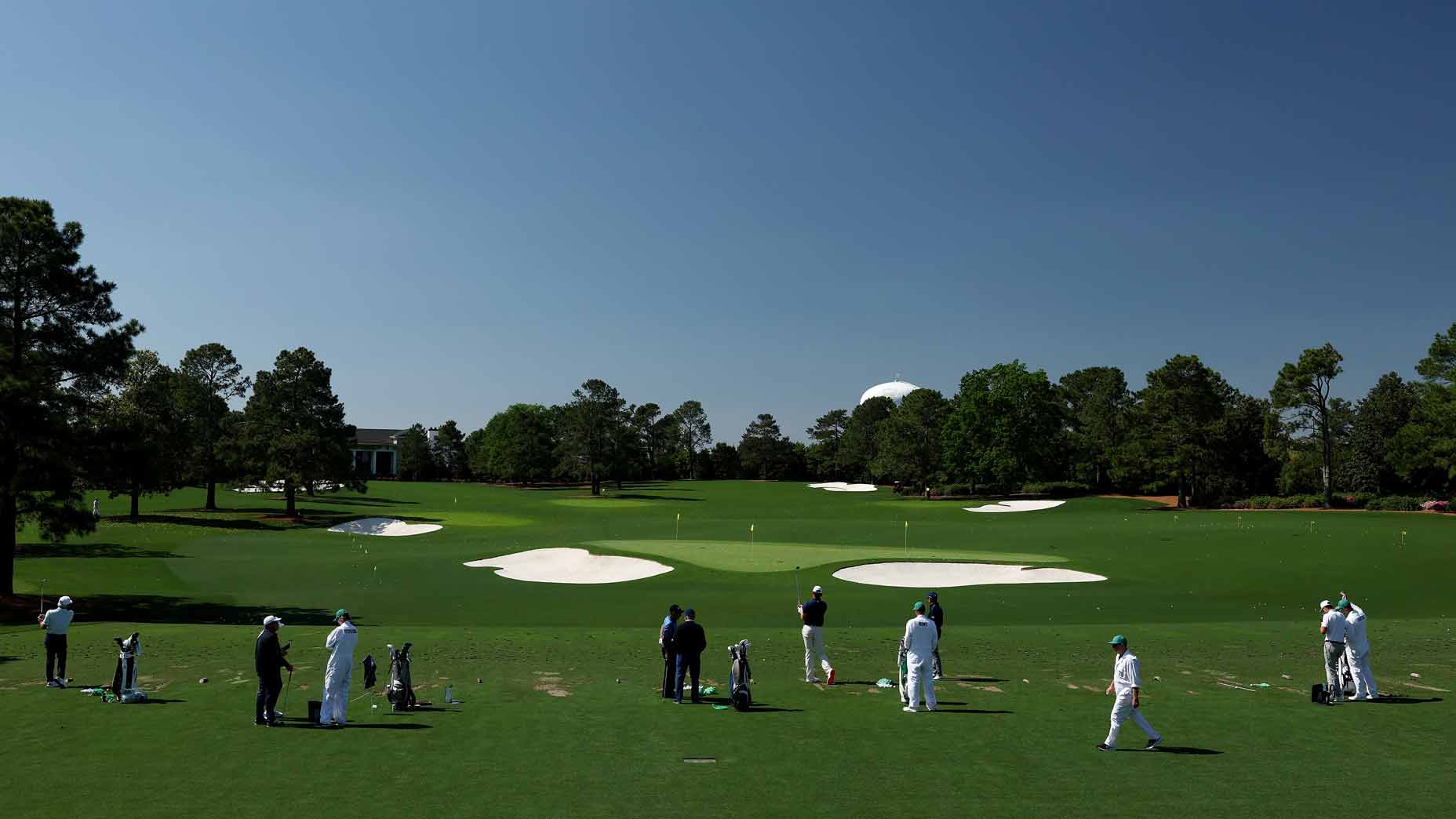 Players on the Masters range.