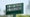 The names of Rory McIlroy of Northern Ireland and Bryson DeChambeau of the United States are displayed in the standard near the first tee during the final round of the 2025 Masters Tournament at Augusta National Golf Club on April 13, 2025 in Augusta, Georgia.