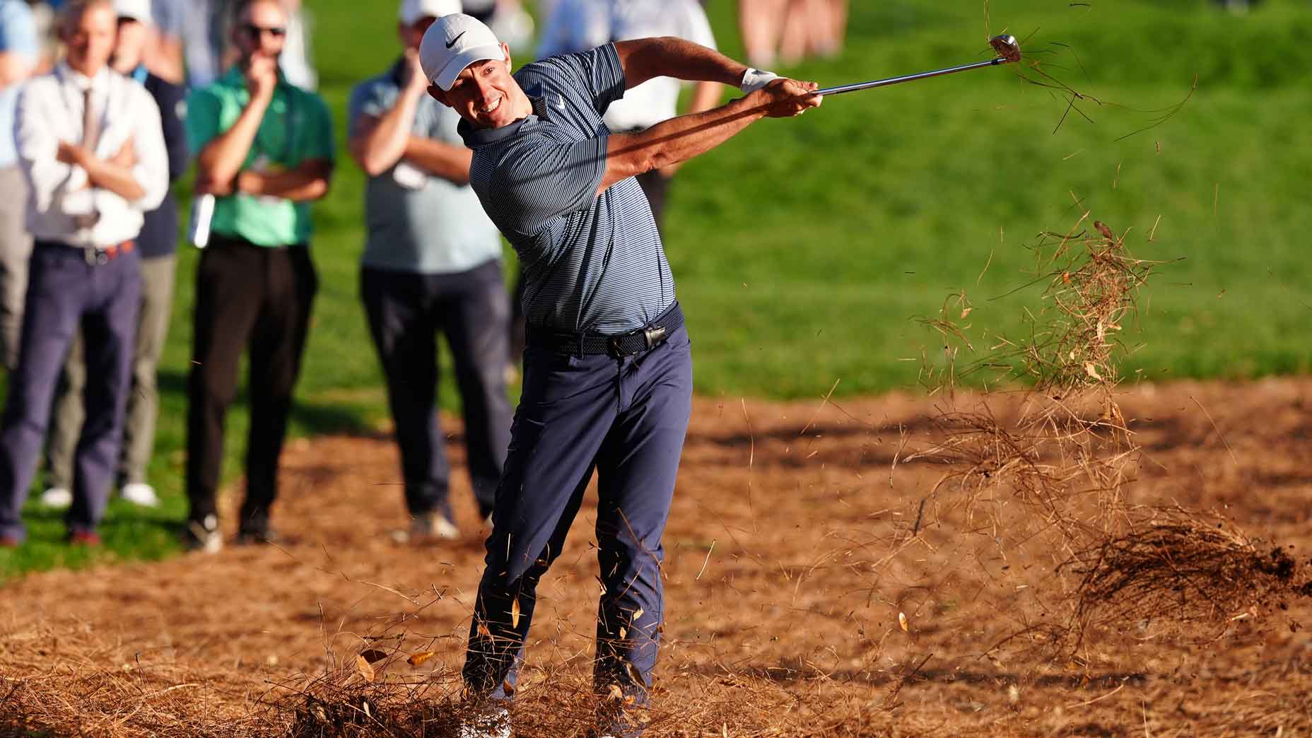 rory mcilroy hits iron shot from the pine straw at augusta national