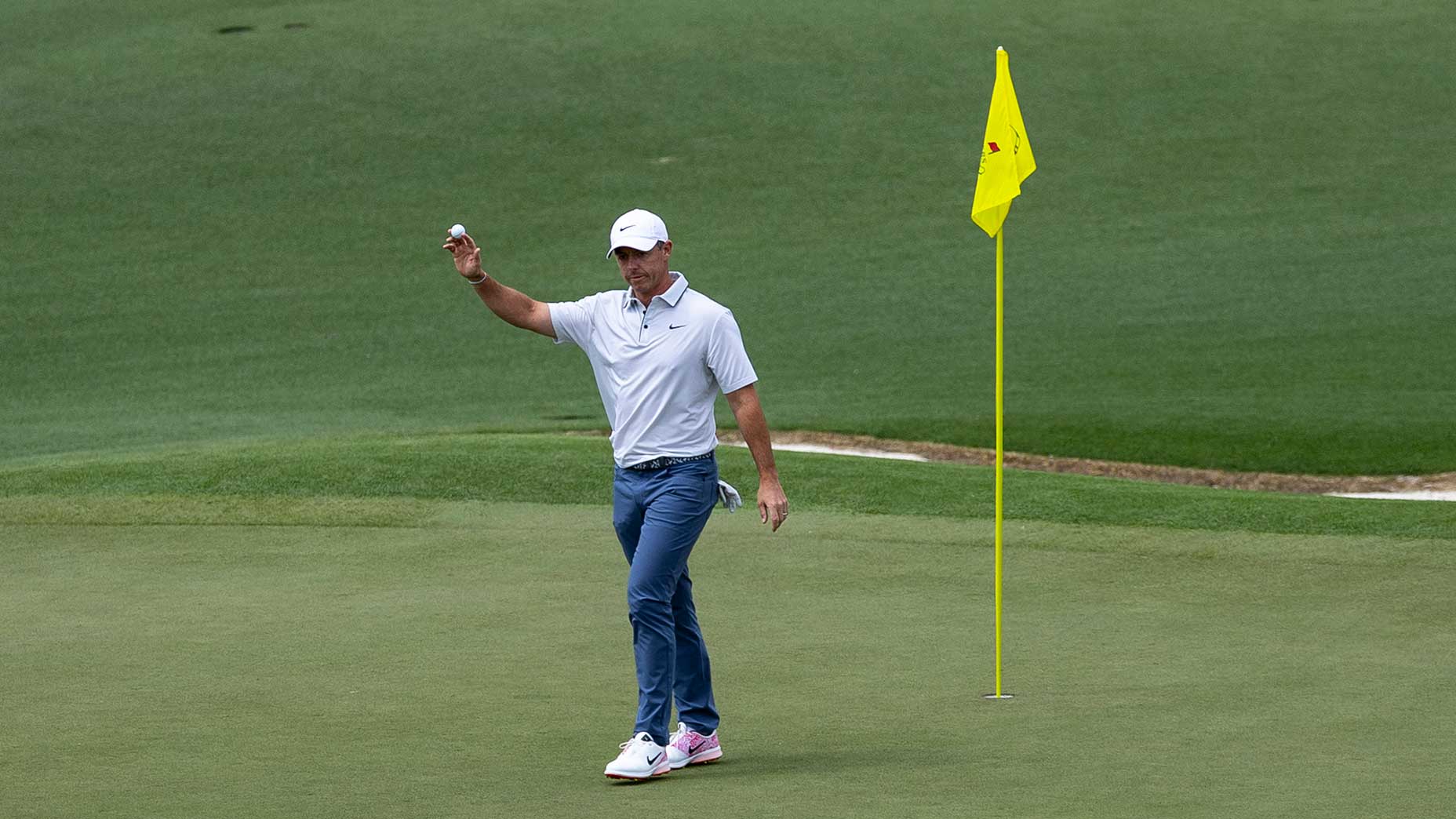 Rory McIlroy waves to patrons saturday at the masters