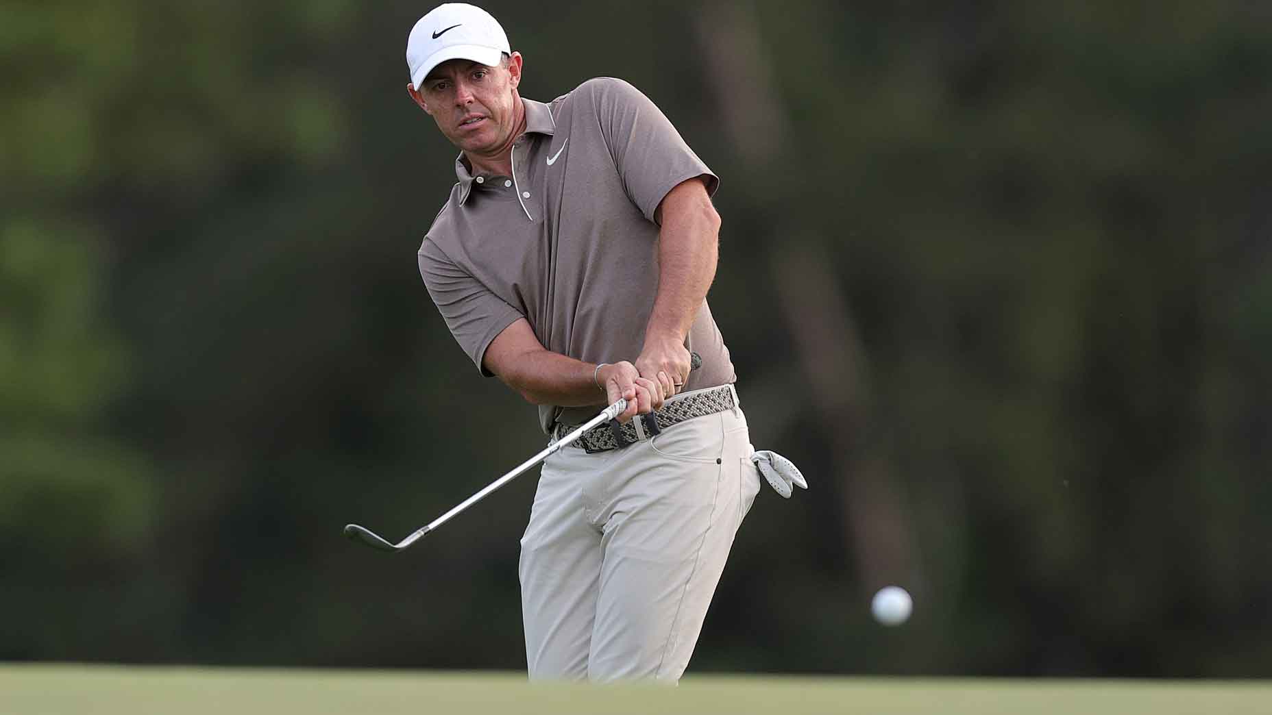 rory mcilroy hits a chip during the opening round of 2025 masters