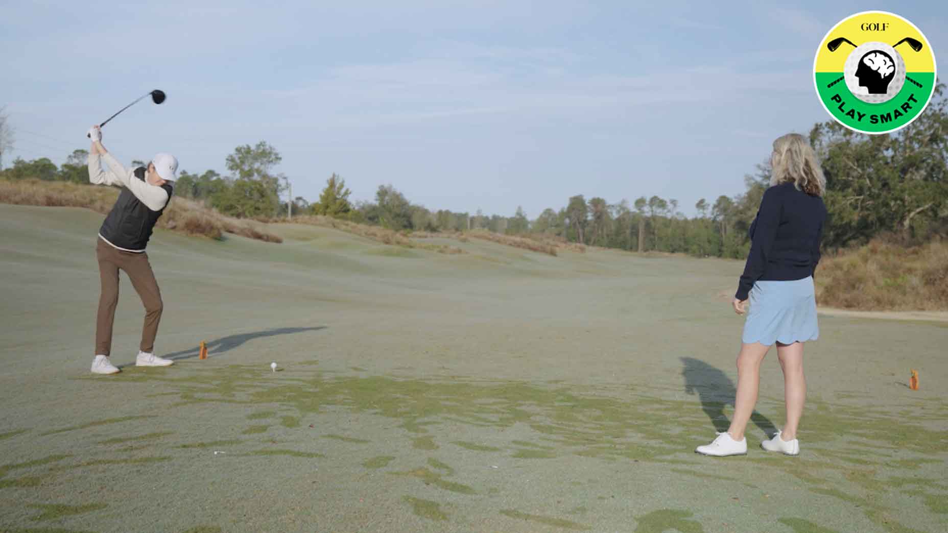 zephyr melton swings while instructor stef shaw looks on