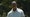 tiger woods grimaces on Saturday at the Masters in a gray shirt