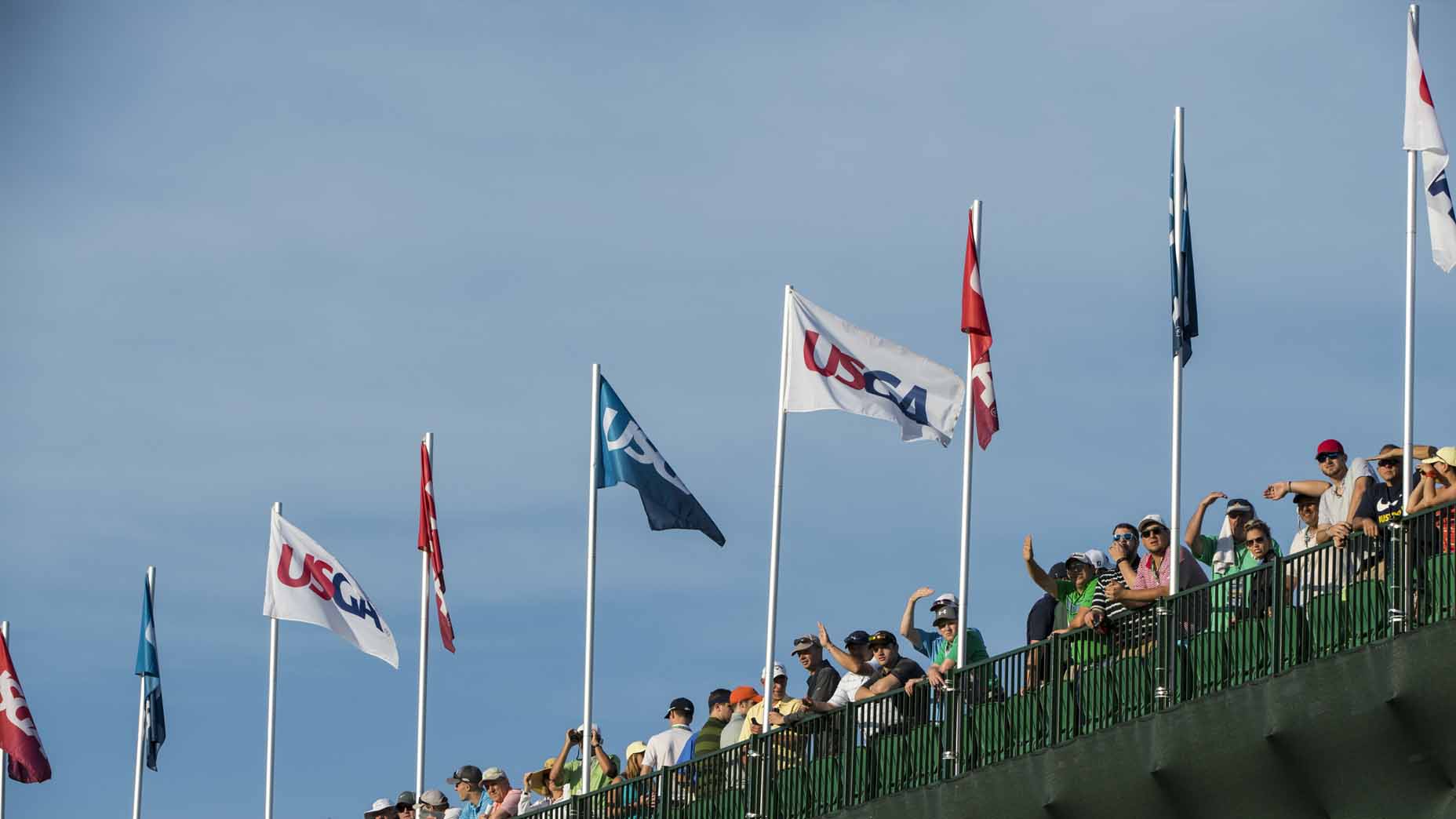USGA flags blow at Oakmont Country Club during the 2016 U.S. Open